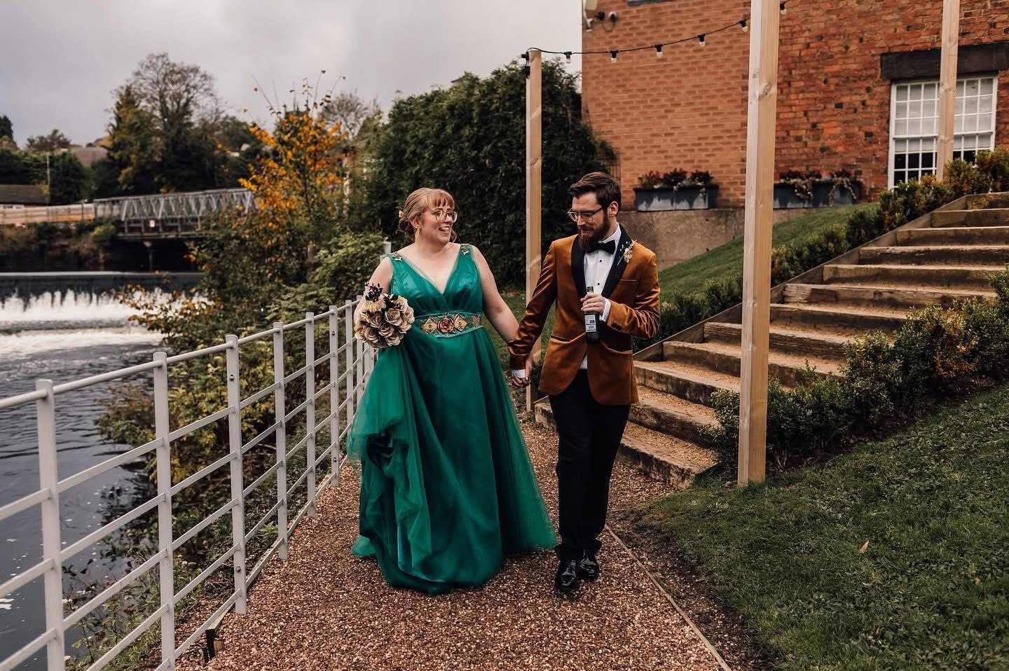Couple walks by river