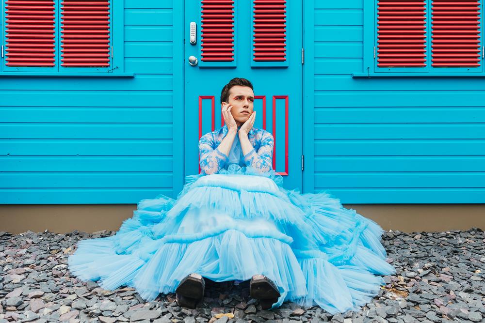 Man in blue tulle dress.