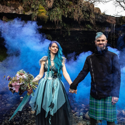 Alternative couple with blue smoke.